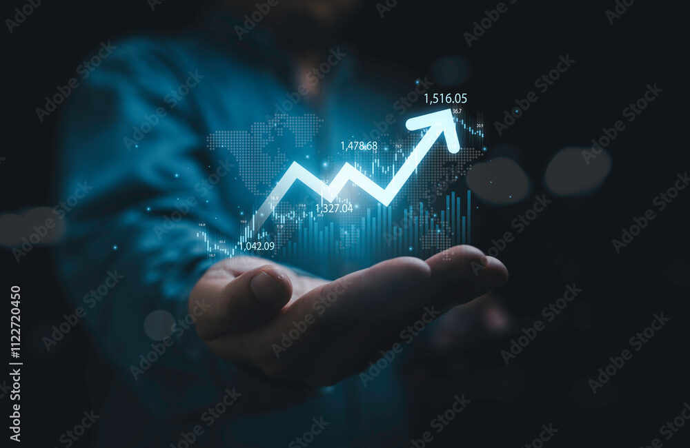 Businessman holding glowing increasing up arrow with stock market graph chart and world map for global economic growth concept.