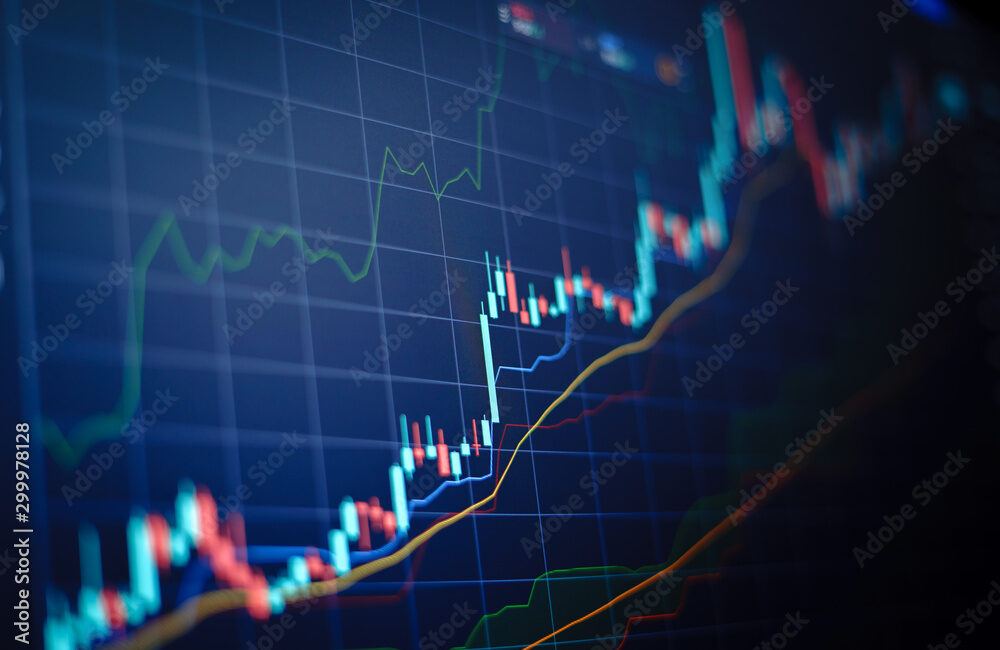 Closeup financial chart with uptrend line candlestick graph in stock market on blue color monitor background